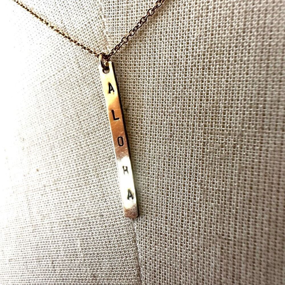 Gold tone aloha  bar pendant necklace
